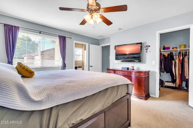 a bedroom with a bed and dresser