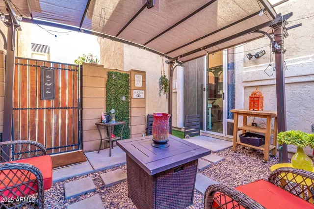 a wooden bench sitting in front of a building