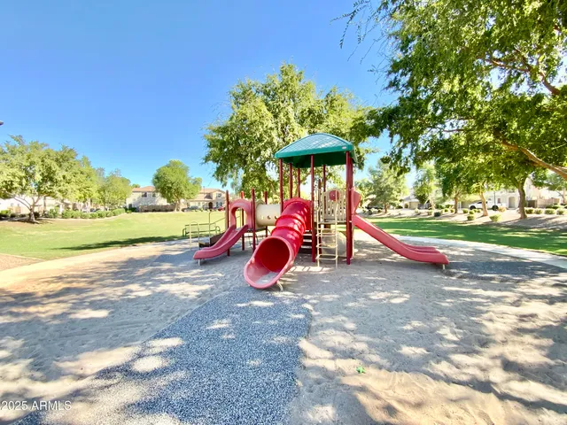 a front view of a building with trees