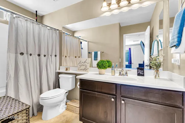 a kitchen with granite countertop stainless steel appliances and refrigerator