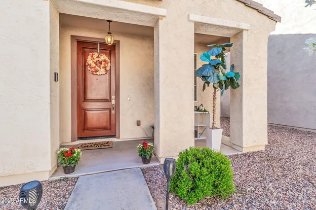 a bathroom with a sink vanity mirror and toilet