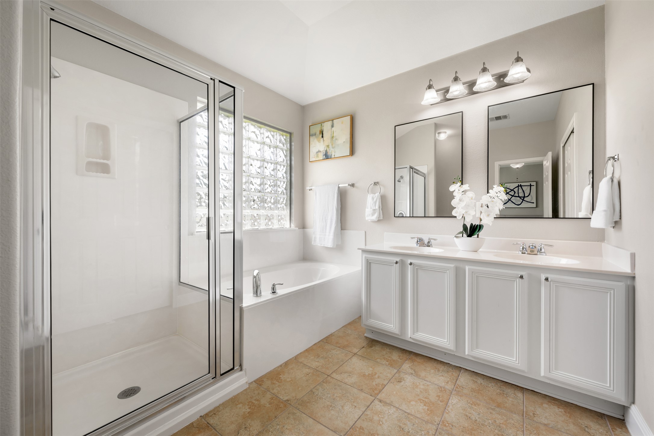 18820 Edinburgh Castle Road Pflugerville, TX 78660 - Photo 28 of 37 a spacious bathroom with a double vanity sink and a mirror