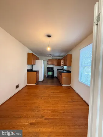a view of a refrigerator in kitchen