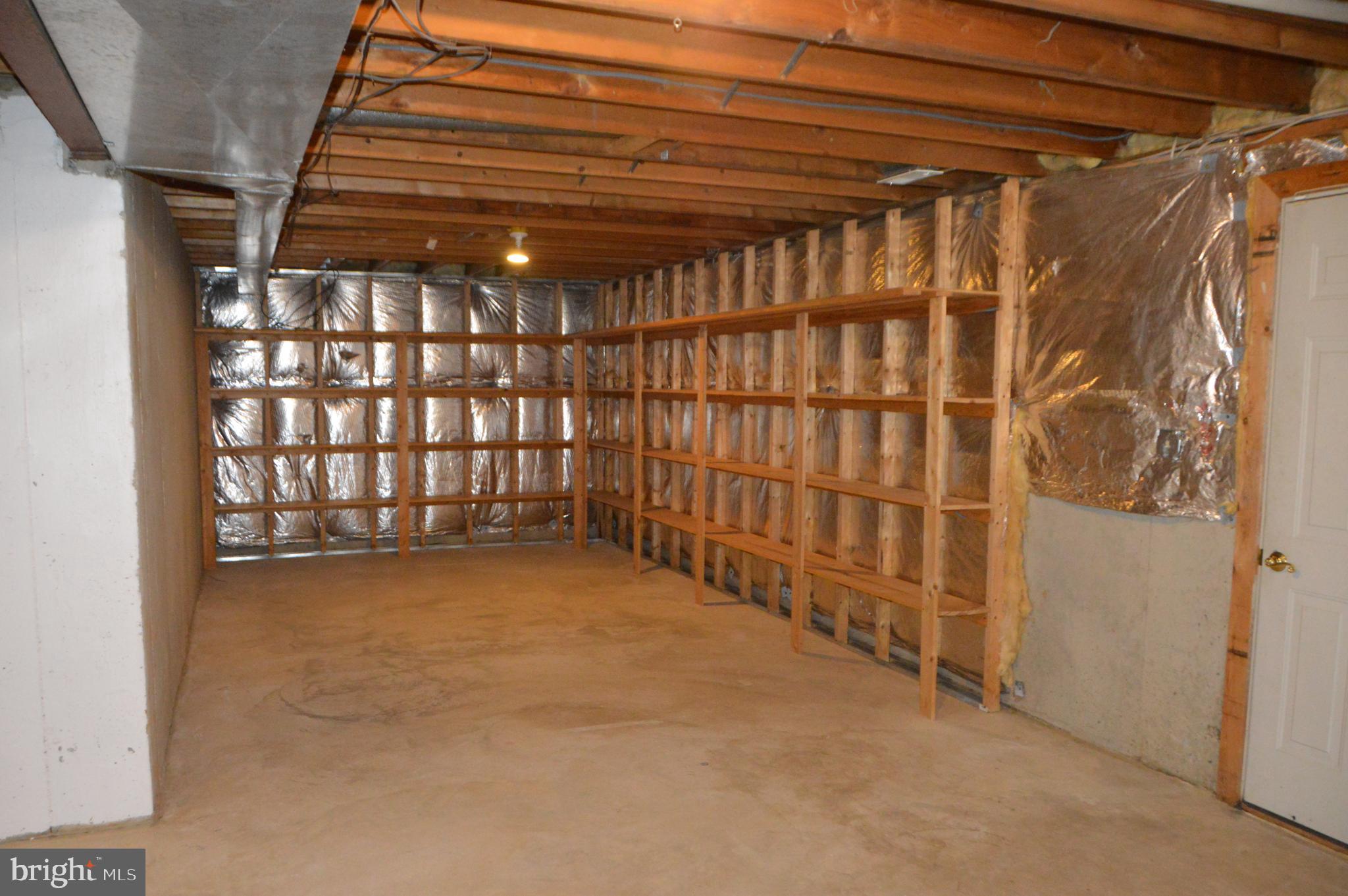 942 Firestone Road Westminster, MD 21158 - Photo 20 of 20 Unfinished basement with shelving