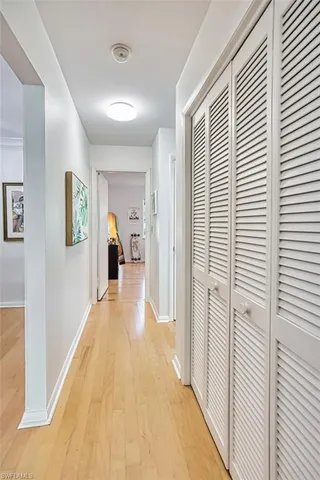a view of a livingroom with wooden floor and stairs