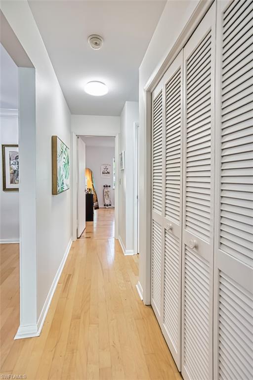 1210 Shady Rest Lane, Unit 14 Naples, FL 34103 - Photo 18 of 30 a view of a livingroom with wooden floor and stairs