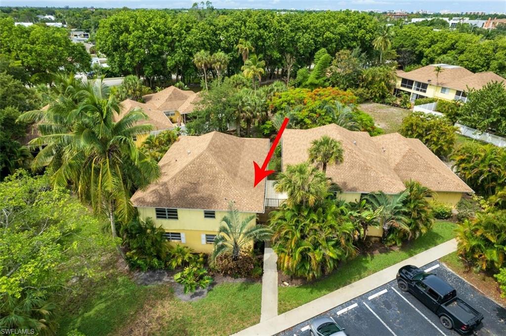 1210 Shady Rest Lane, Unit 14 Naples, FL 34103 - Photo 2 of 30 an aerial view of house with yard and swimming pool