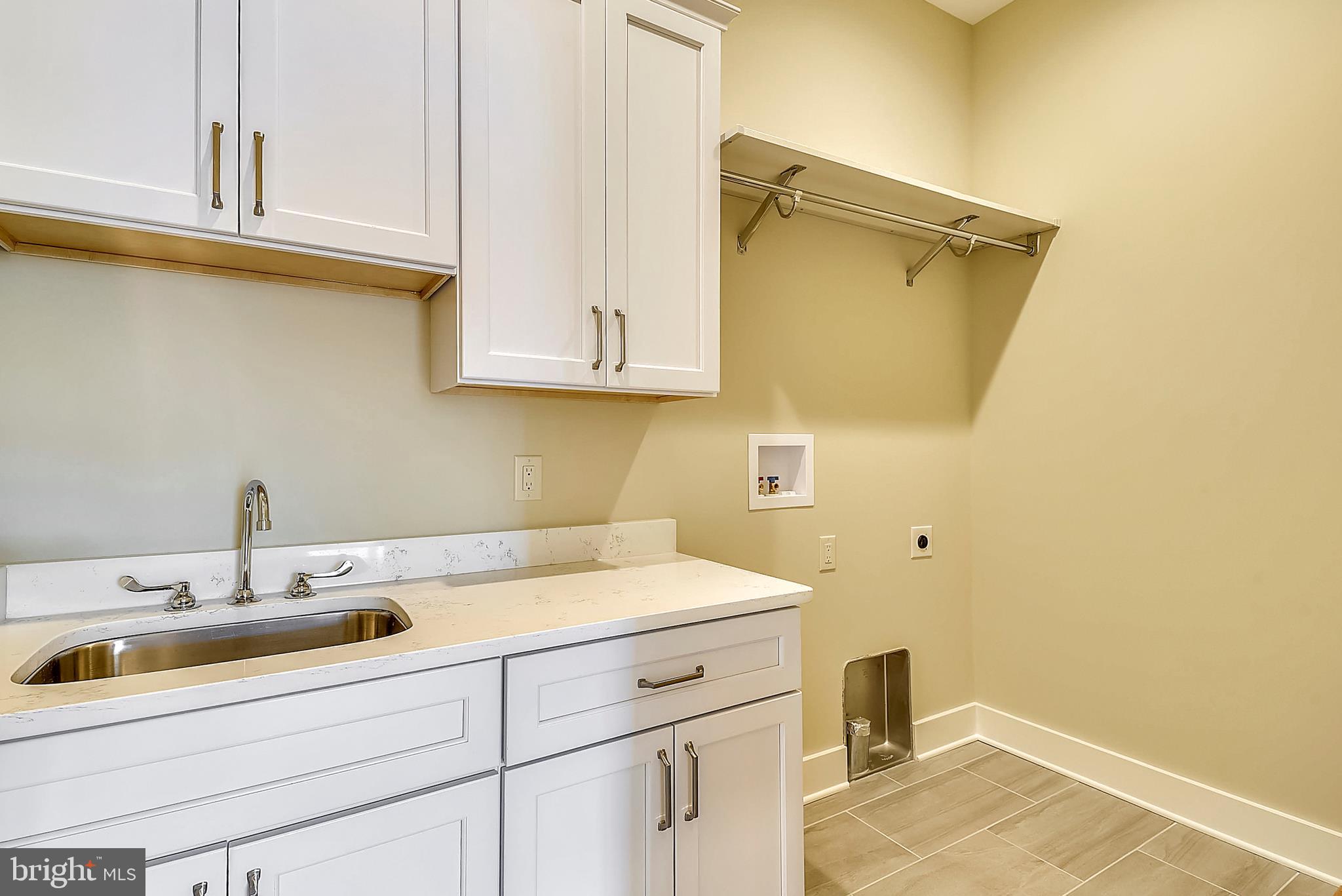 32863 Widgeon Road, Unit 14 Ocean View, DE 19970 - Photo 42 of 73 Main level laundry (standard: sink/lower cabinets)