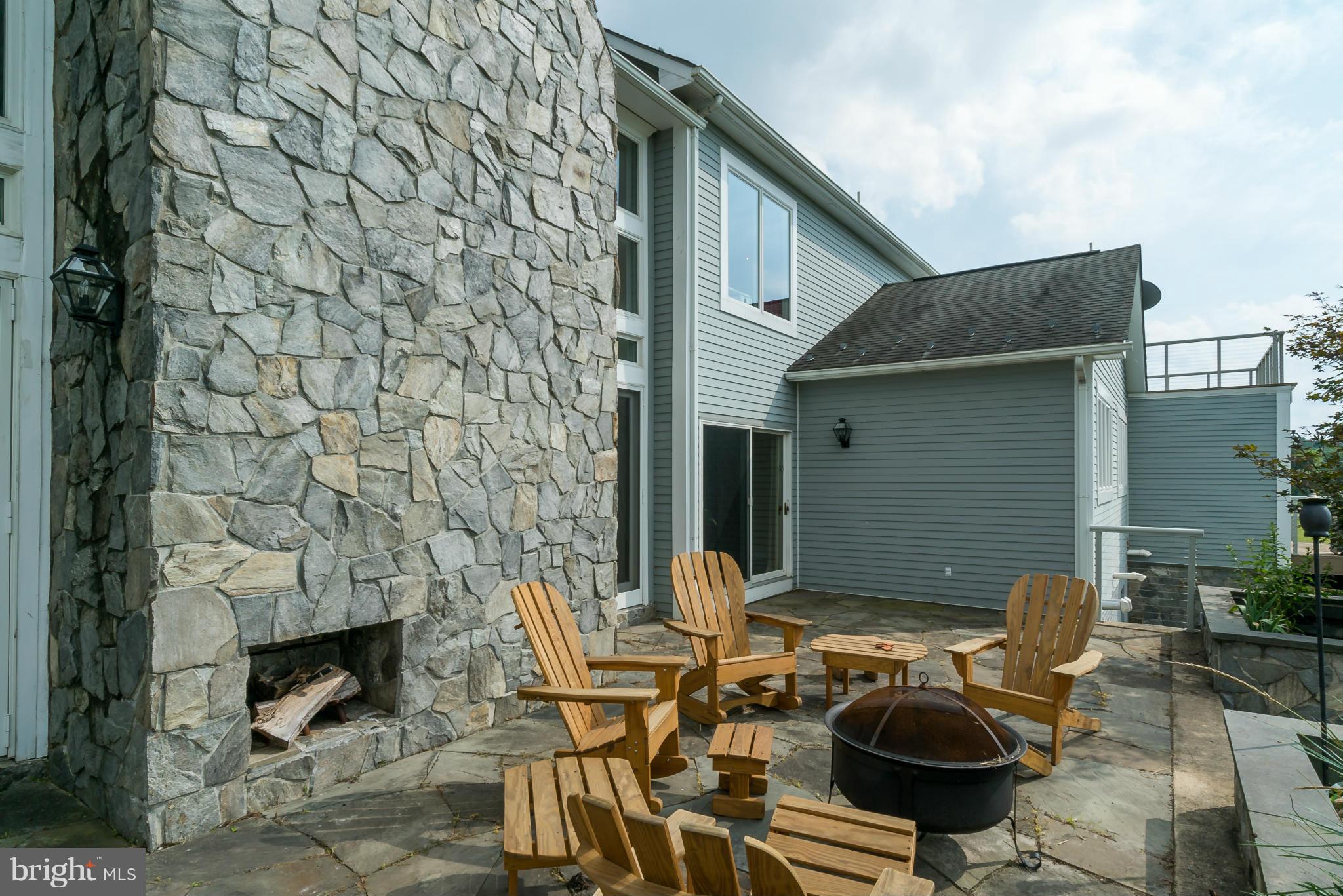 15657 Limestone School Road Leesburg, VA 20176 - Photo 3 of 30 Stone Patio with Outdoor Fireplace/chimney