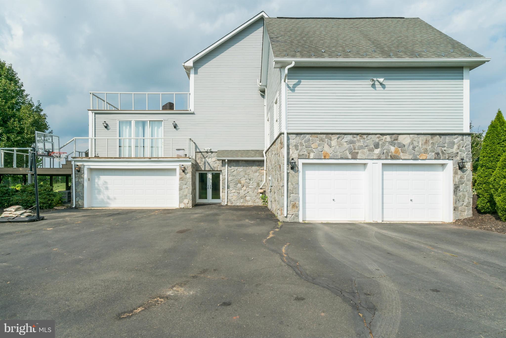 15657 Limestone School Road Leesburg, VA 20176 - Photo 5 of 30 Four car side load garages w walkout from basement