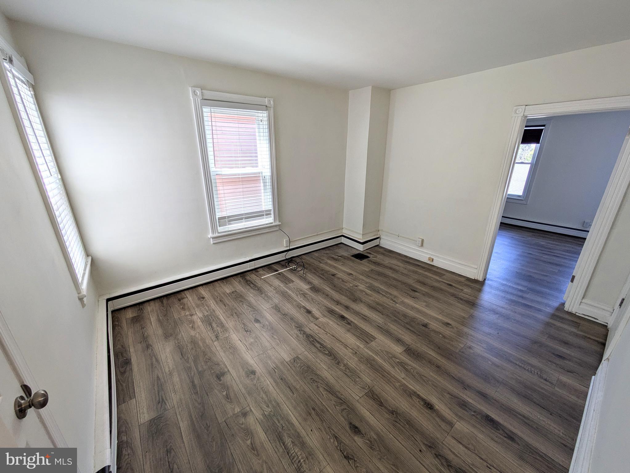 429 West South Street Slatington, PA 18080 - Photo 12 of 22 a view of an empty room with wooden floor and a window