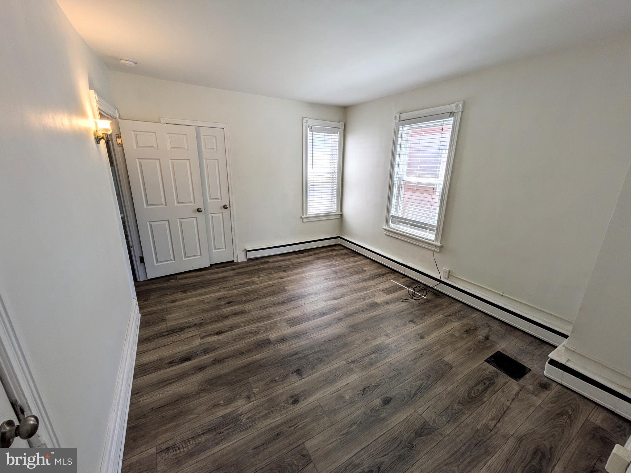 429 West South Street Slatington, PA 18080 - Photo 13 of 22 an empty room with wooden floor and windows