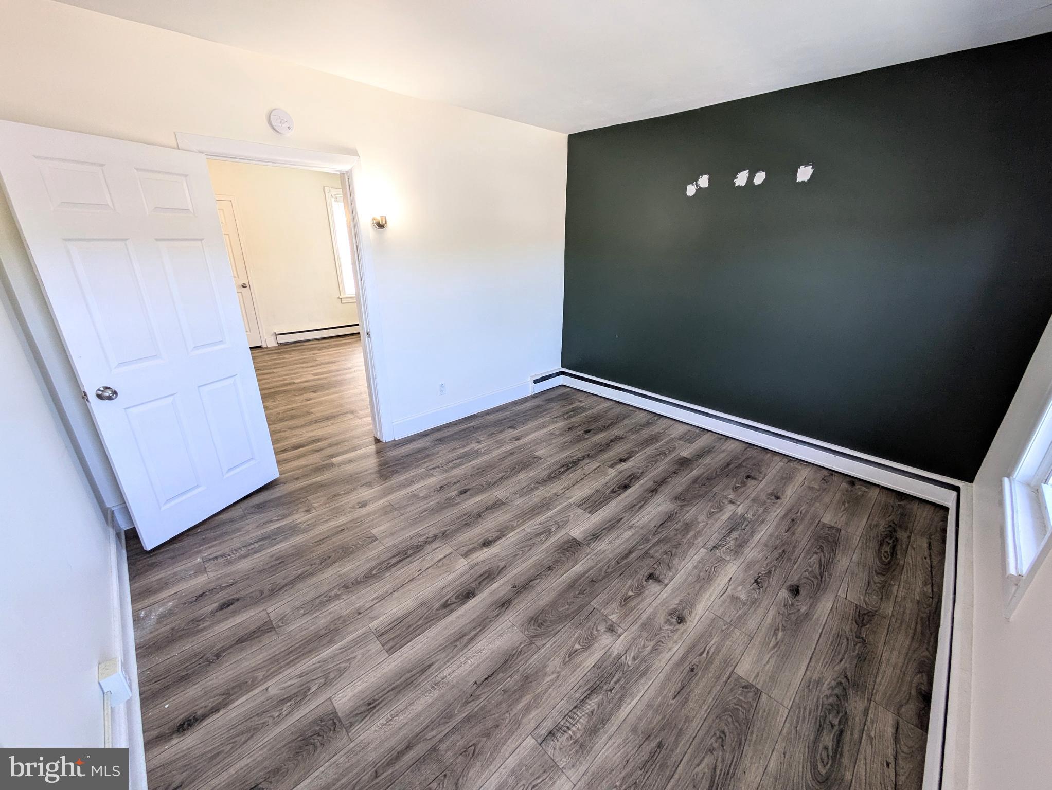 429 West South Street Slatington, PA 18080 - Photo 15 of 22 wooden floor in an empty room with a window