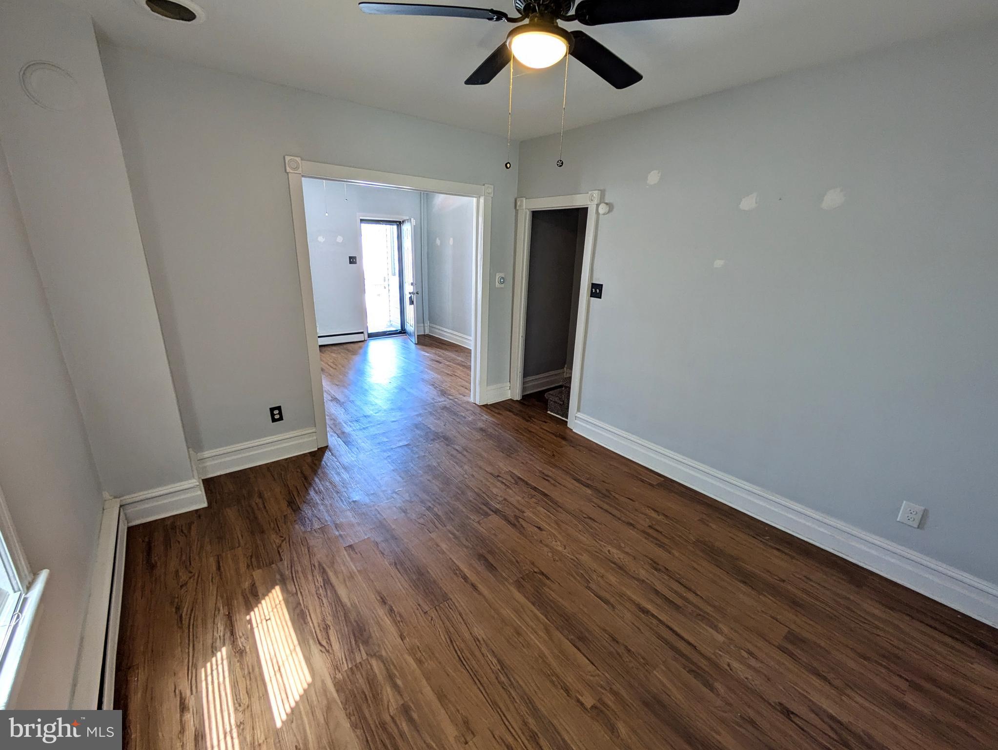 429 West South Street Slatington, PA 18080 - Photo 7 of 22 wooden floor in an empty room with a window