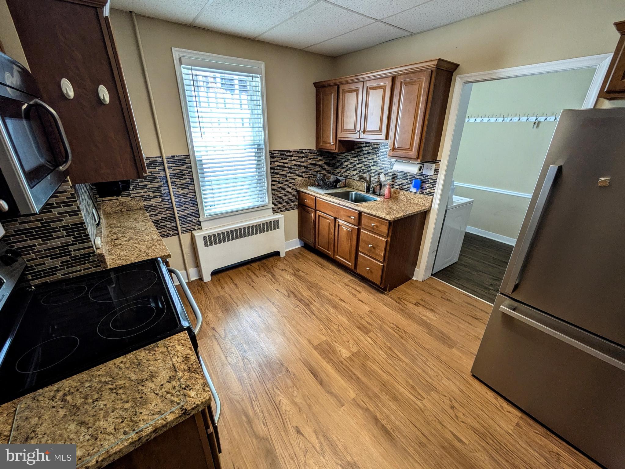 429 West South Street Slatington, PA 18080 - Photo 9 of 22 a kitchen with wooden floors and a stove