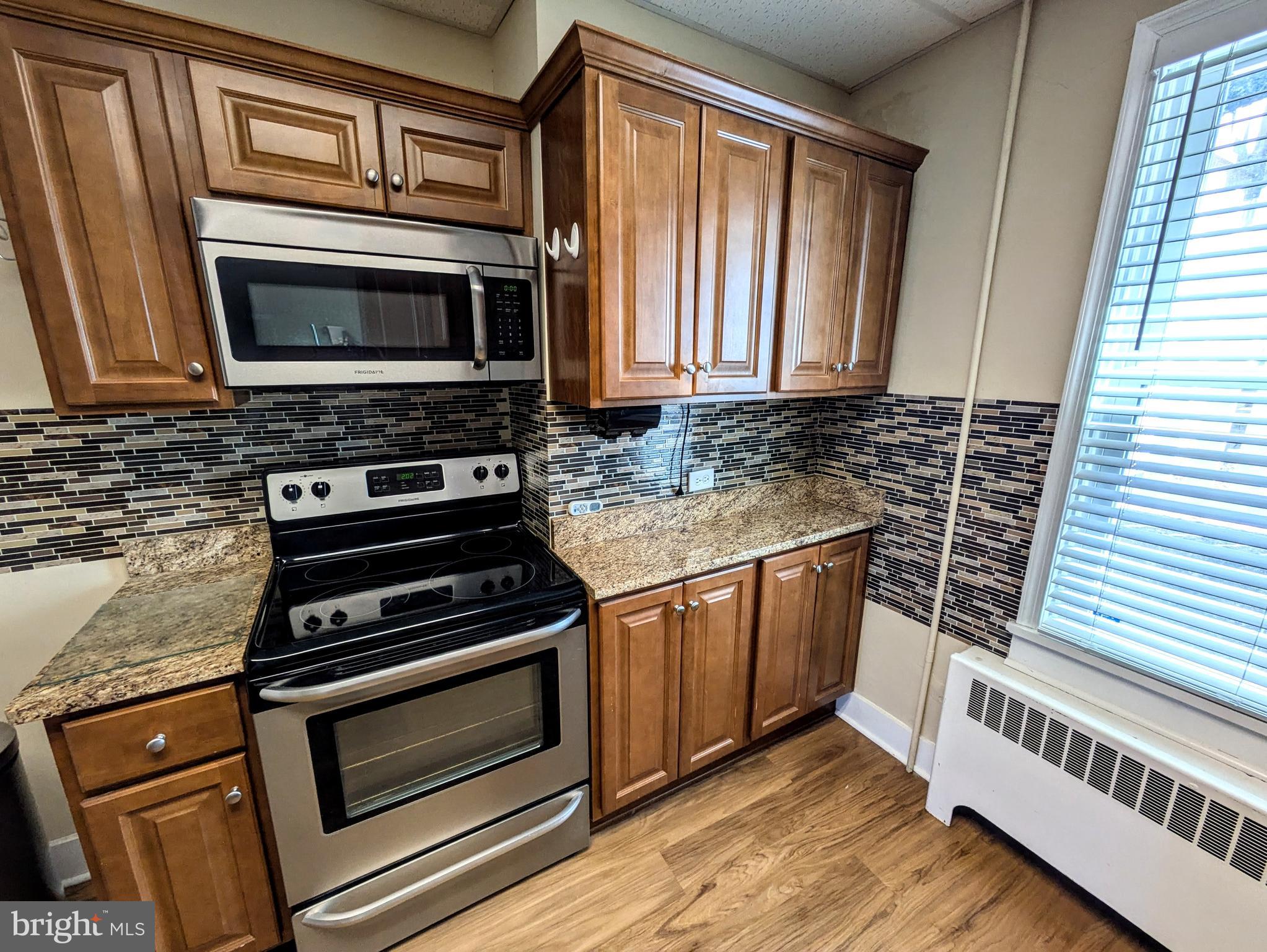 429 West South Street Slatington, PA 18080 - Photo 10 of 22 a kitchen with wooden cabinets and a stove top oven