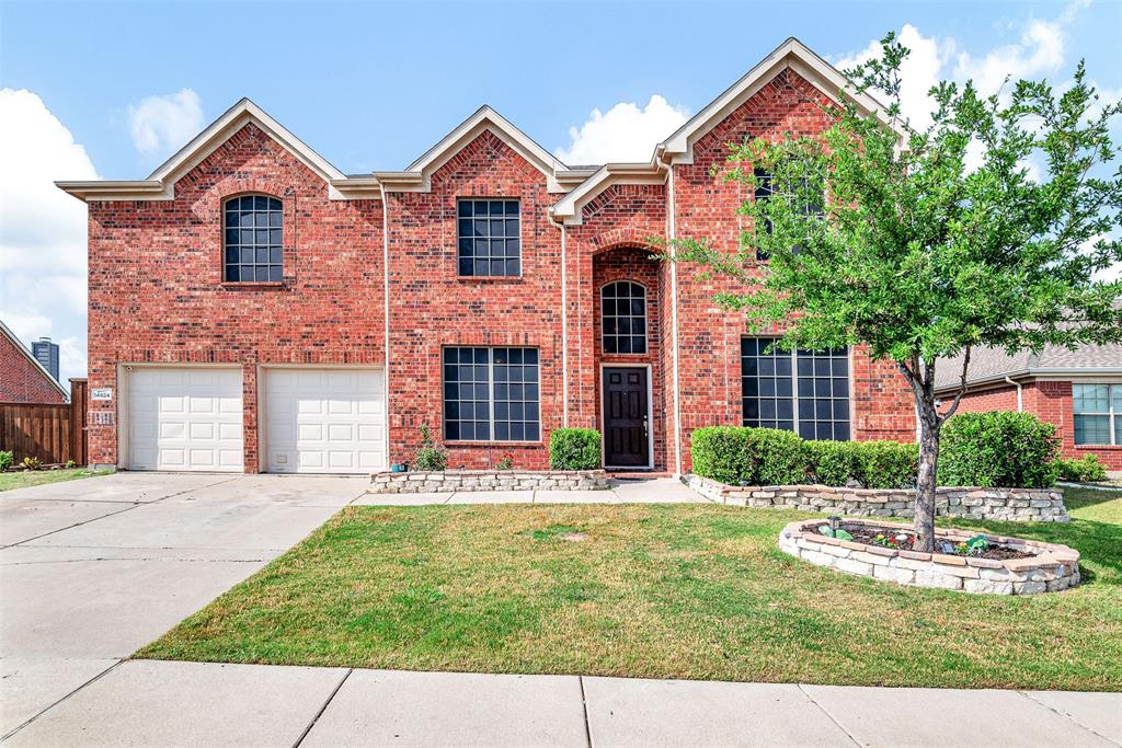 14924 Lone Spring Drive Little Elm, TX 75068 - Photo 1 of 1 a front view of a house with a yard and garage