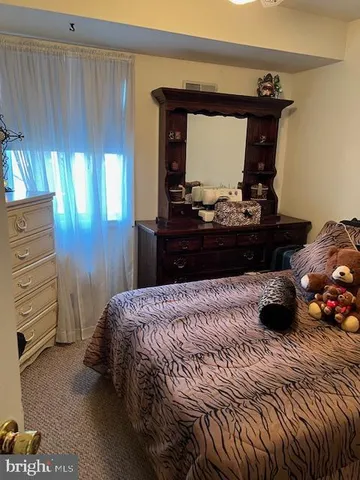 a view of entryway and livingroom with wooden floor