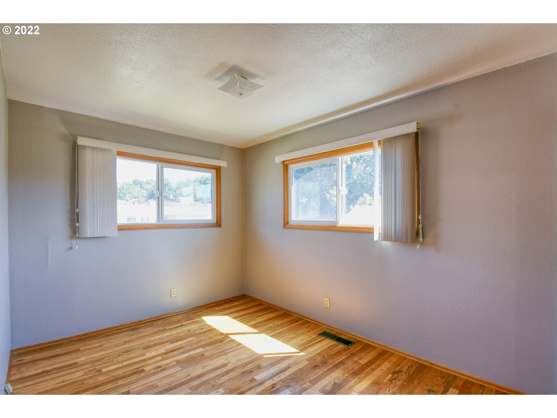 3231 Southwest Isaac Avenue Pendleton, OR 97801 - Photo 18 of 32 a view of empty room with wooden floor