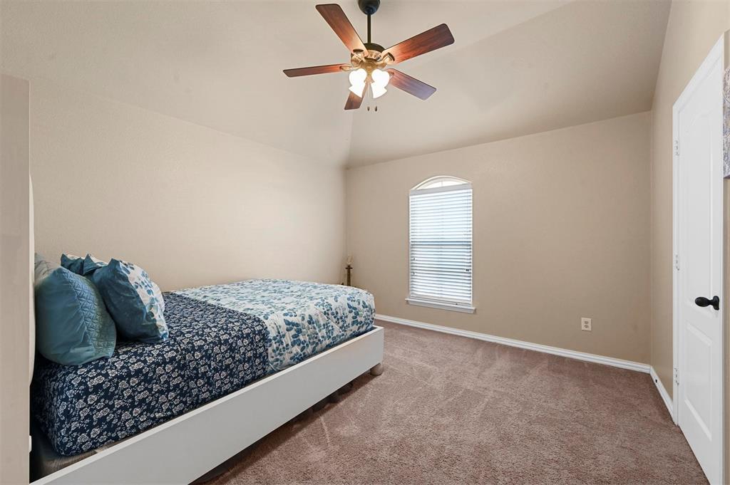 14815 Frisco Ranch Drive Little Elm, TX 75068 - Photo 32 of 40 a bedroom with a bed and window