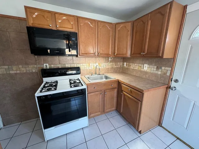 a kitchen with a stove and a microwave