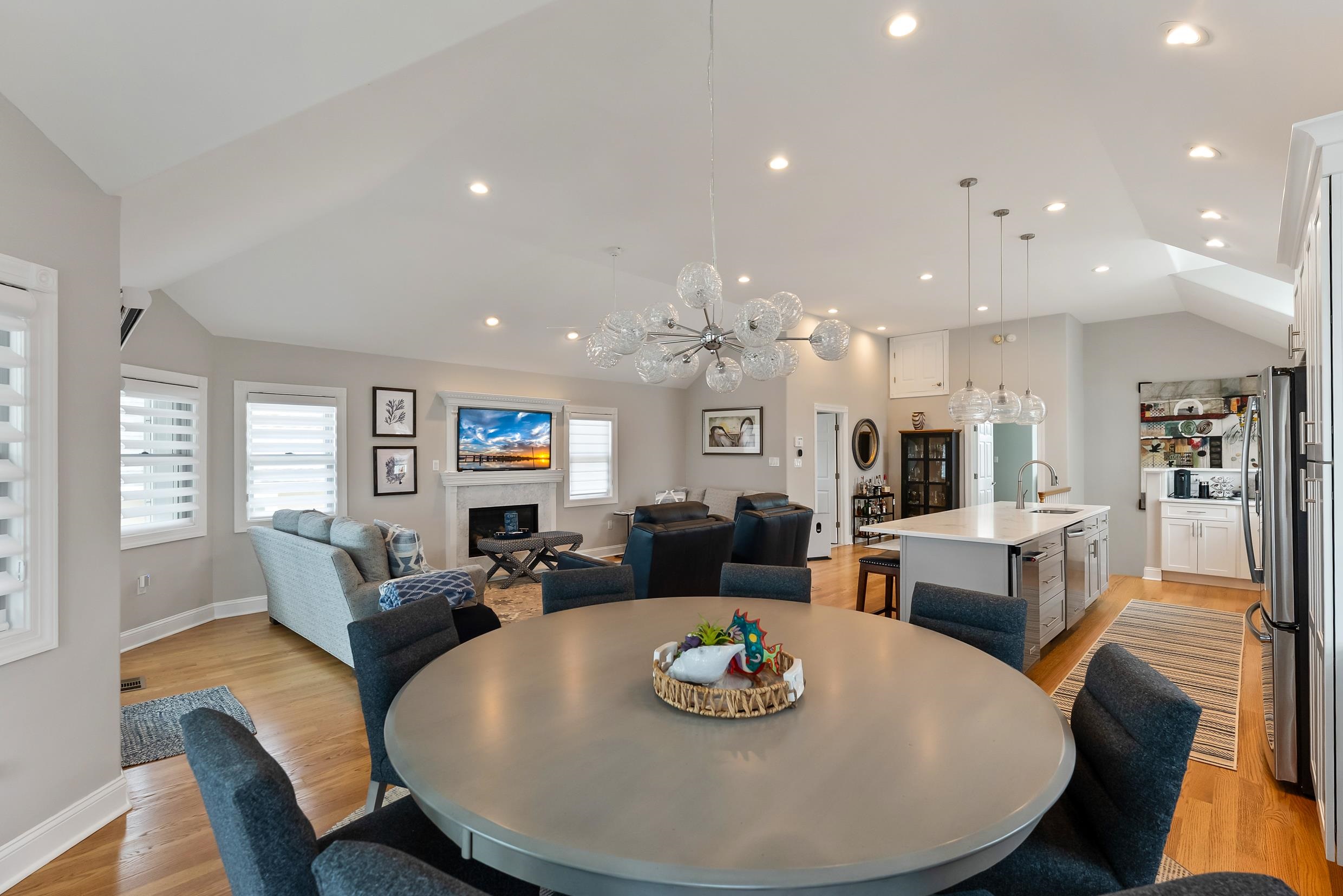 120 113th Street Stone Harbor, NJ 08247 - Photo 11 of 50 a living room with kitchen couches and a dining table with wooden floor