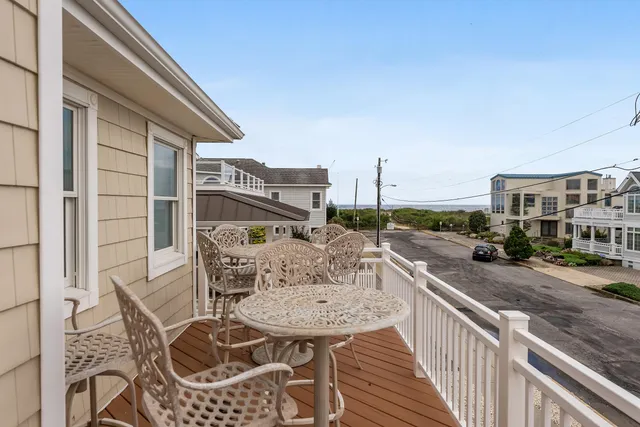 a view of a patio with couches table and chairs