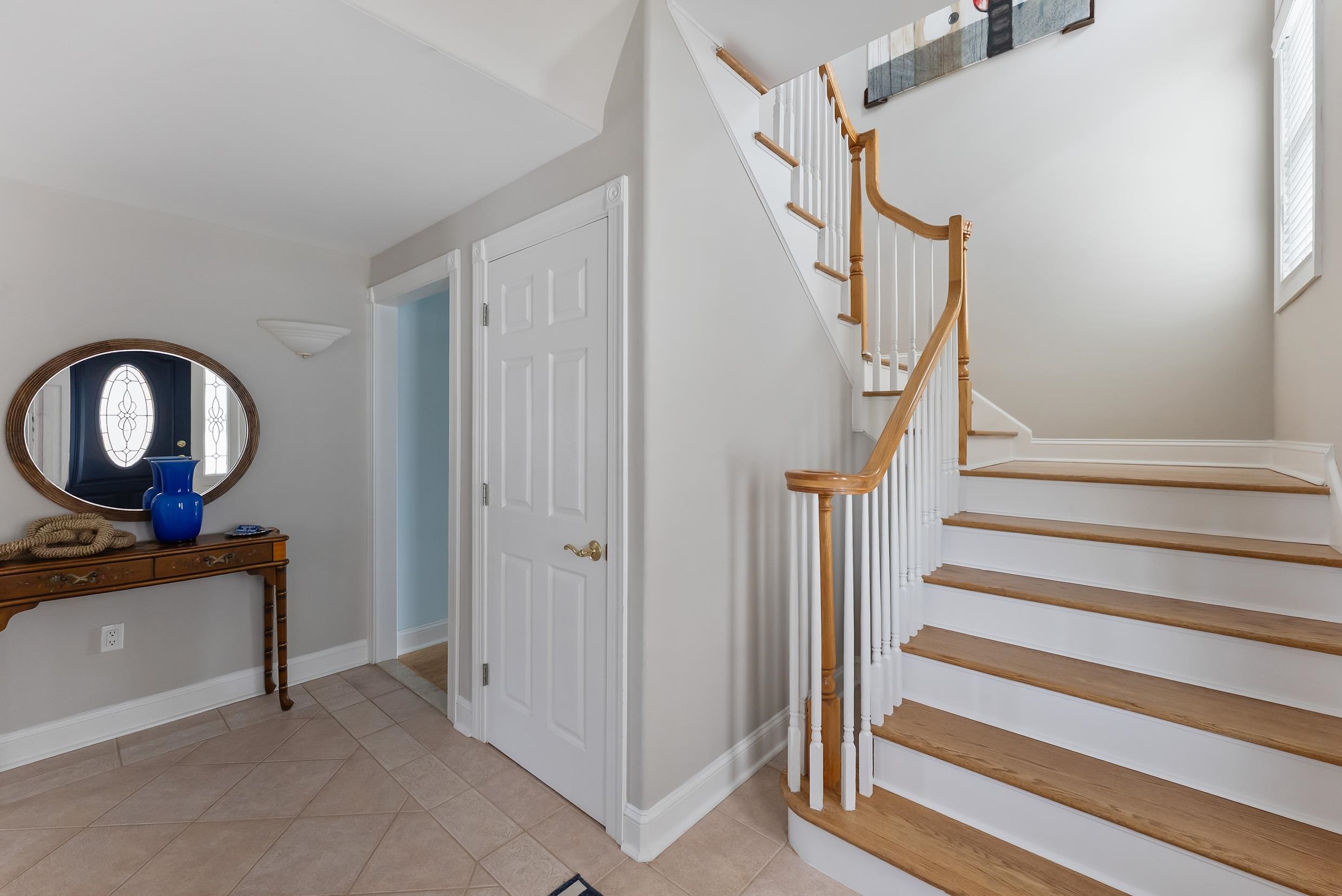 120 113th Street Stone Harbor, NJ 08247 - Photo 24 of 50 a view of a hallway with entryway wooden floor and front door