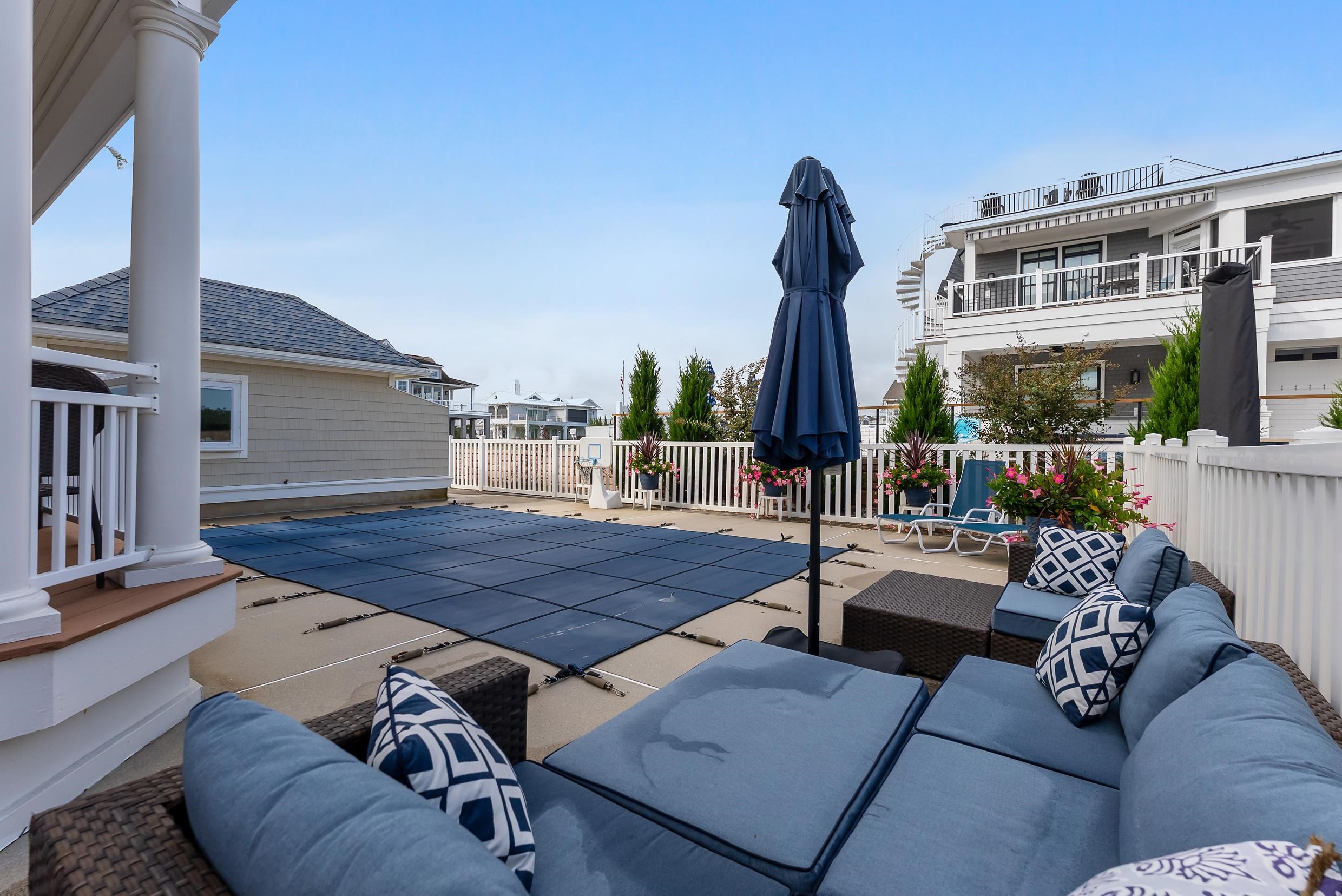 120 113th Street Stone Harbor, NJ 08247 - Photo 29 of 50 a view of a patio with couches and potted plants