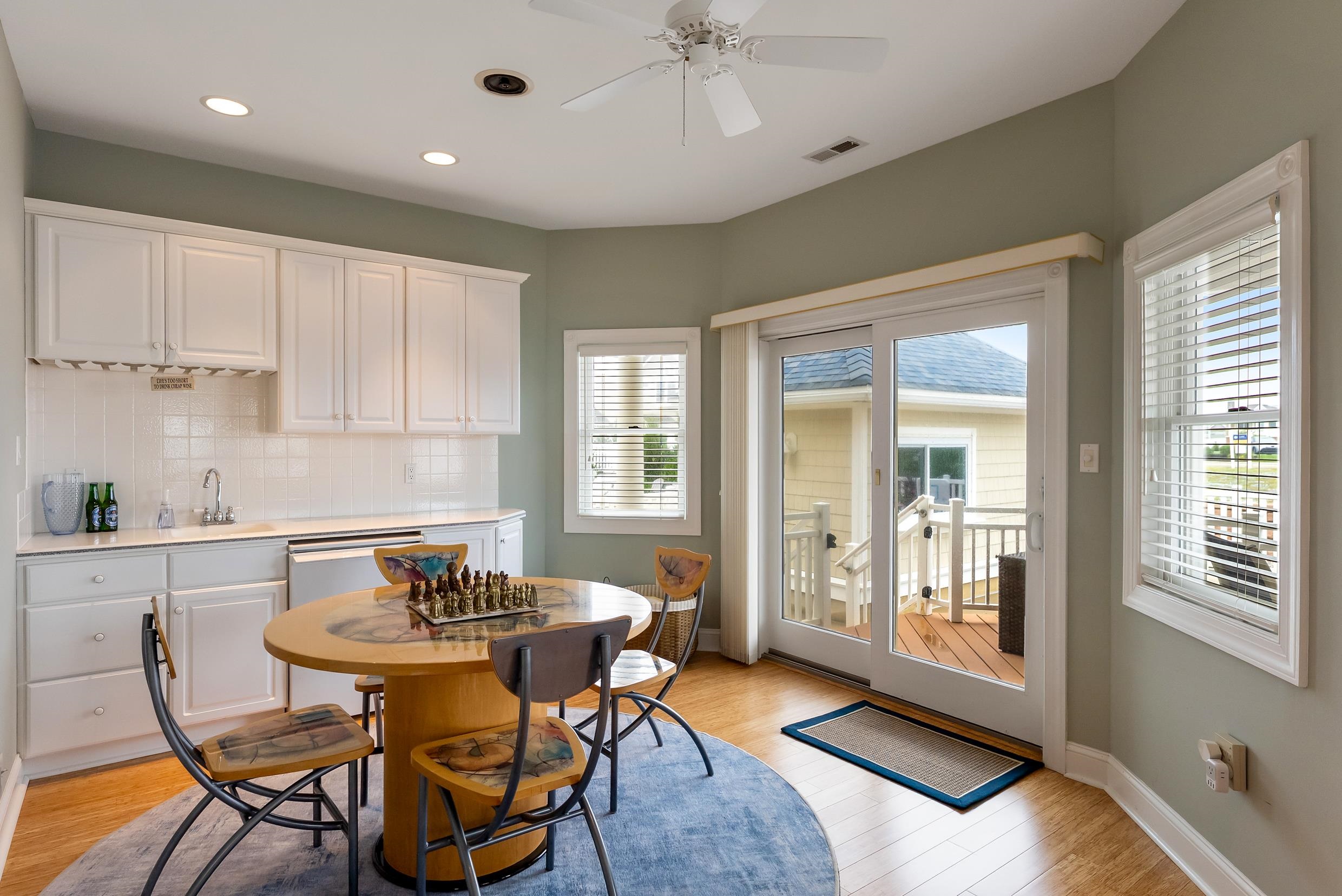 120 113th Street Stone Harbor, NJ 08247 - Photo 33 of 50 a kitchen with a table and chairs in it