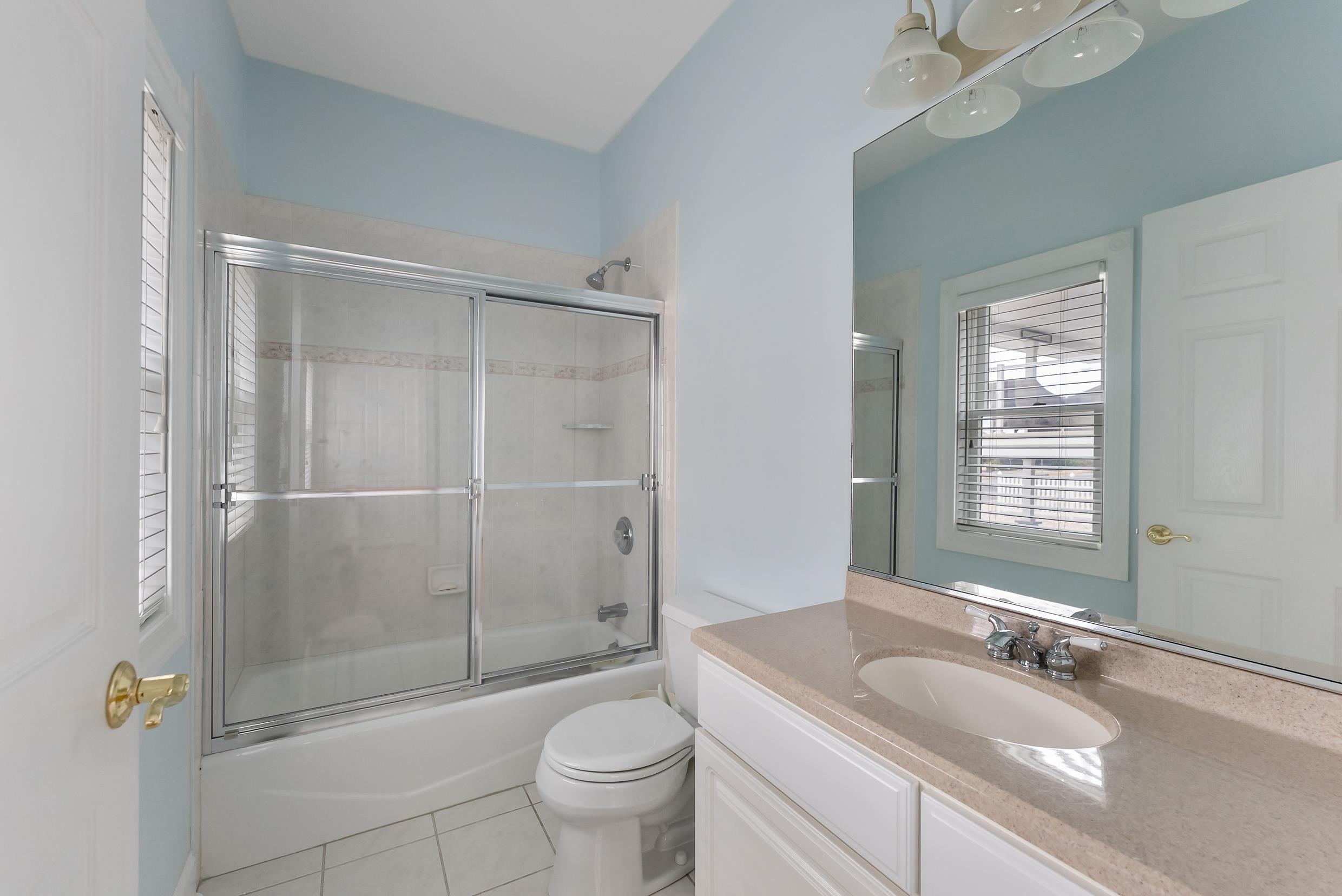 120 113th Street Stone Harbor, NJ 08247 - Photo 39 of 50 a bathroom with a granite countertop sink a toilet and shower