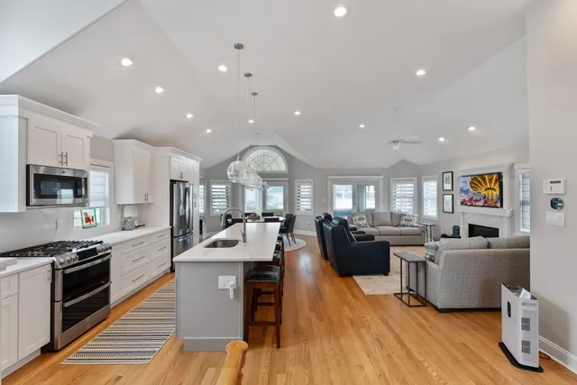 a large kitchen with a table and chairs