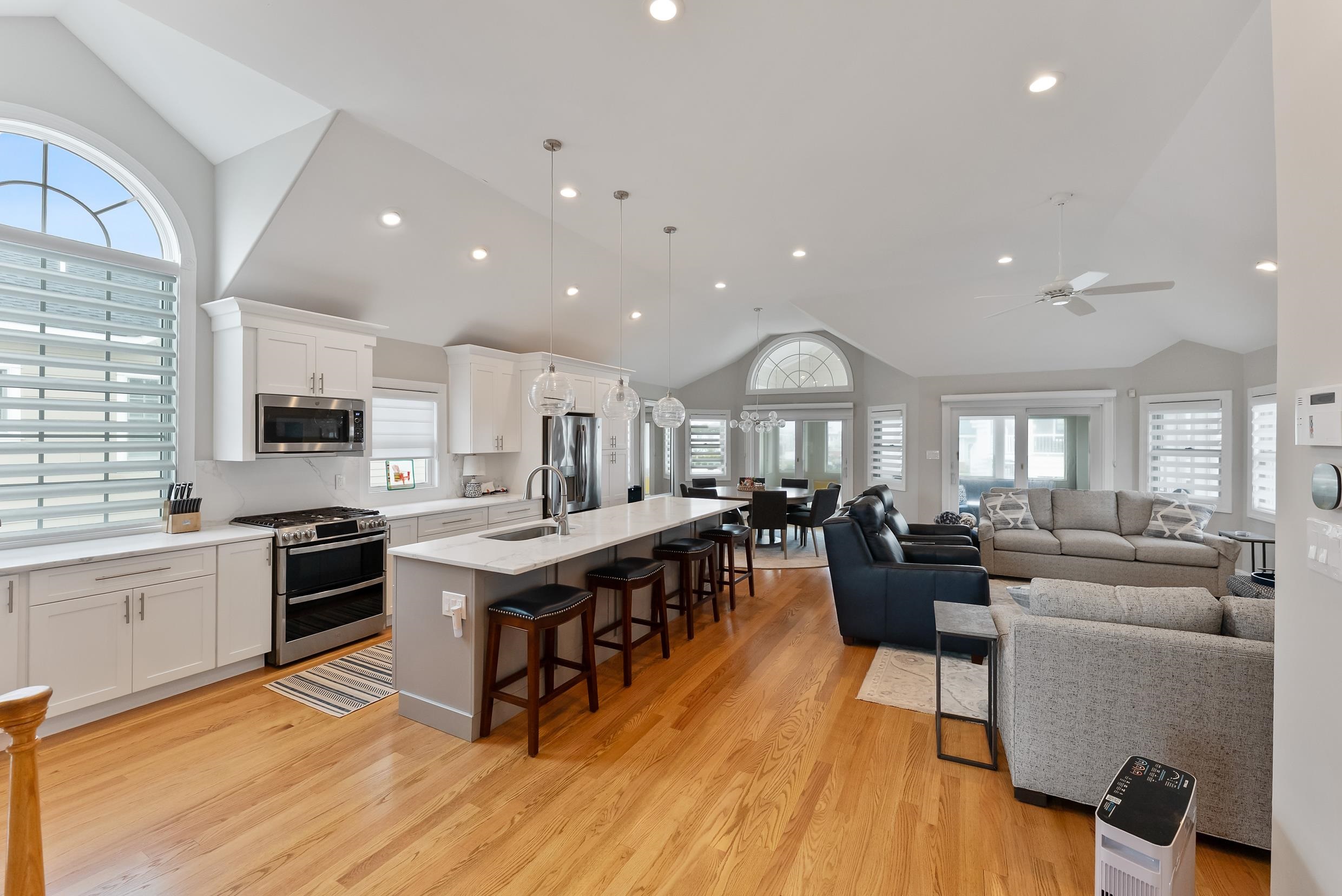 120 113th Street Stone Harbor, NJ 08247 - Photo 5 of 50 a living room with stainless steel appliances granite countertop furniture wooden floor and a view of kitchen