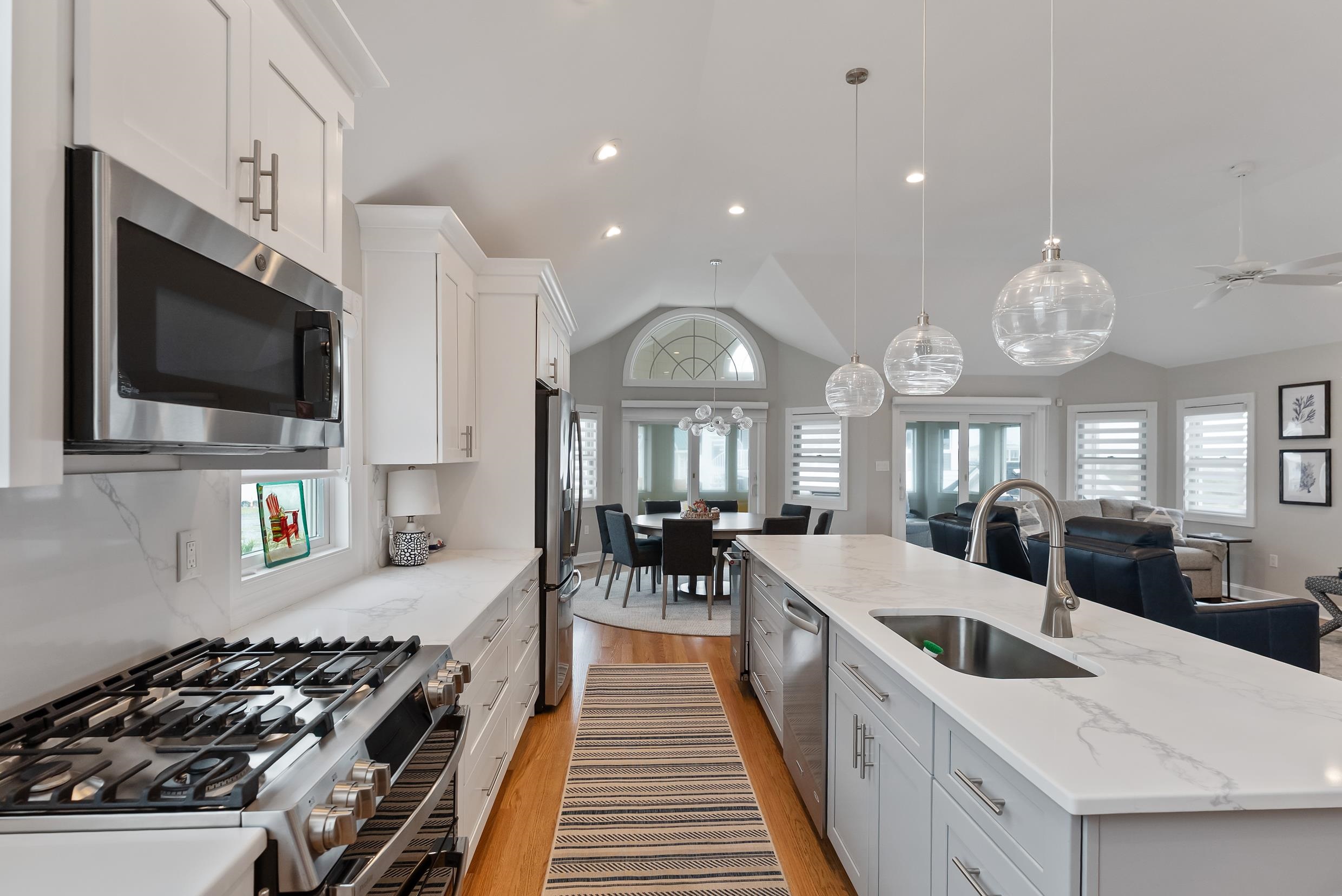 120 113th Street Stone Harbor, NJ 08247 - Photo 9 of 50 a large kitchen with lots of counter space a sink and stainless steel appliances