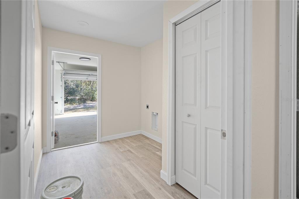 2988 Southwest Bonable Drive Dunnellon, FL 34431 - Photo 13 of 22 a view of an empty room with wooden floor and a window