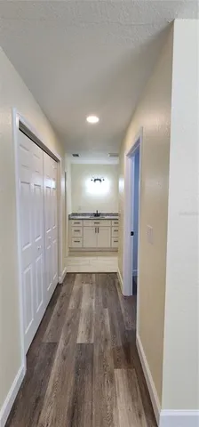 a view of a hardwood floor in a room