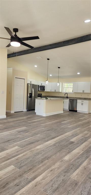 2988 Southwest Bonable Drive Dunnellon, FL 34431 - Photo 4 of 22 a view of a kitchen with kitchen island a sink stainless steel appliances and cabinets