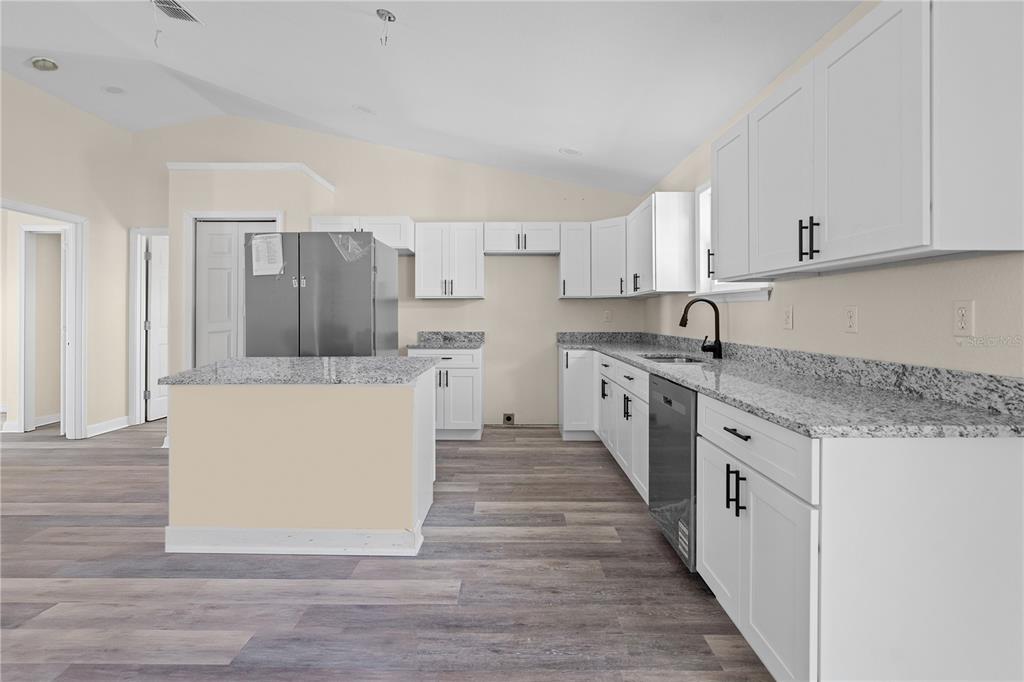 2988 Southwest Bonable Drive Dunnellon, FL 34431 - Photo 7 of 22 a kitchen with a sink and cabinets