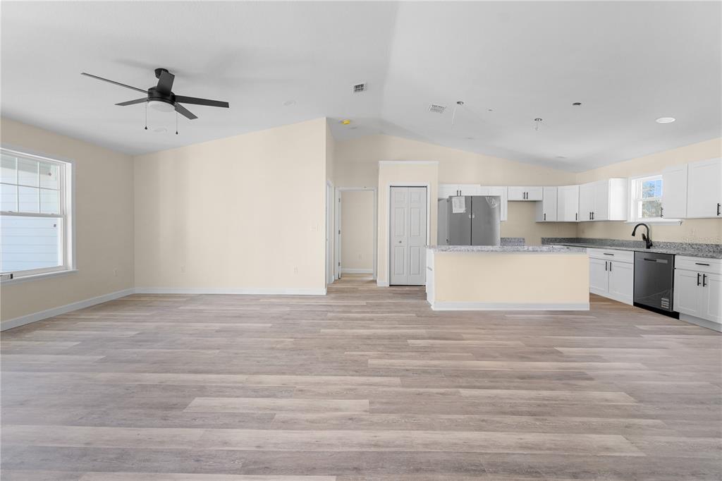 2988 Southwest Bonable Drive Dunnellon, FL 34431 - Photo 9 of 22 a view of kitchen with wooden cabinet and refrigerator