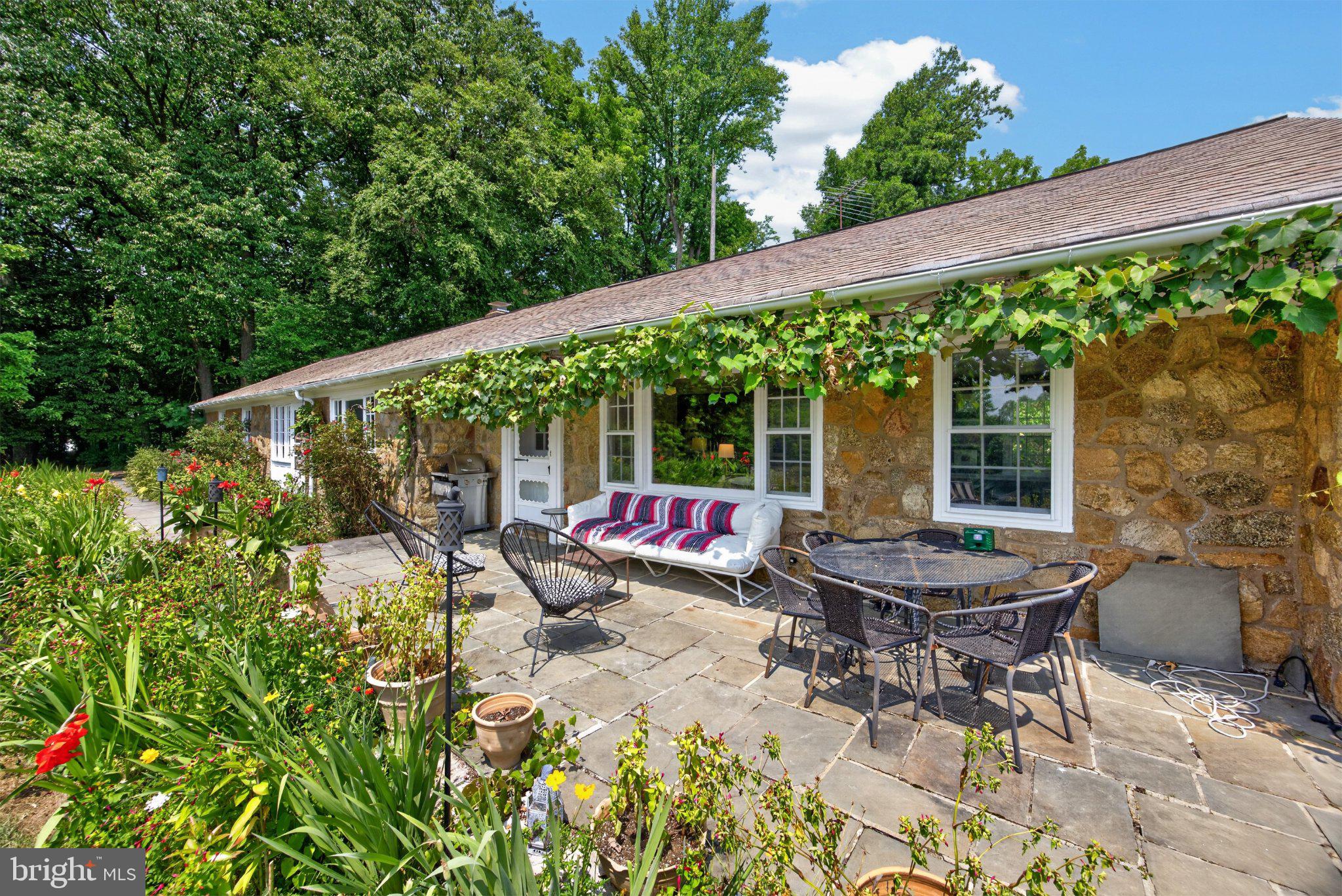 1015 Chester Springs Road Phoenixville, PA 19460 - Photo 1 of 68 Charming stone home with lush gardens.