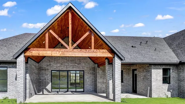 a view of a house with wooden floor and a yard