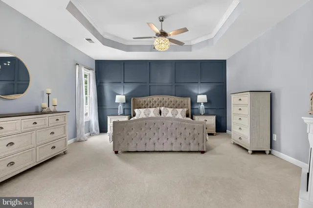 a en suite bathroom with a double vanity sink a mirror and a