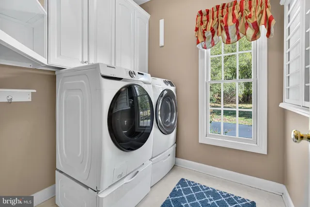 a kitchen with a stove a sink and a refrigerator