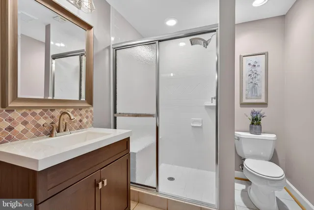 a front view of a house with swimming pool and sitting area