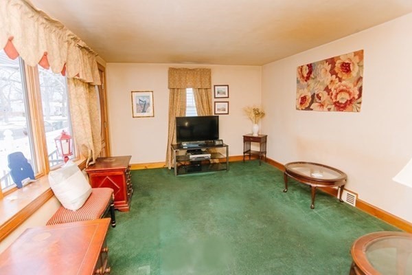 67 Campechi Street Springfield, MA 01104 - Photo 15 of 41 a living room with furniture and a flat screen tv