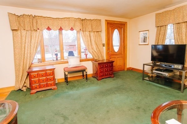 67 Campechi Street Springfield, MA 01104 - Photo 17 of 41 a living room with furniture and a flat screen tv