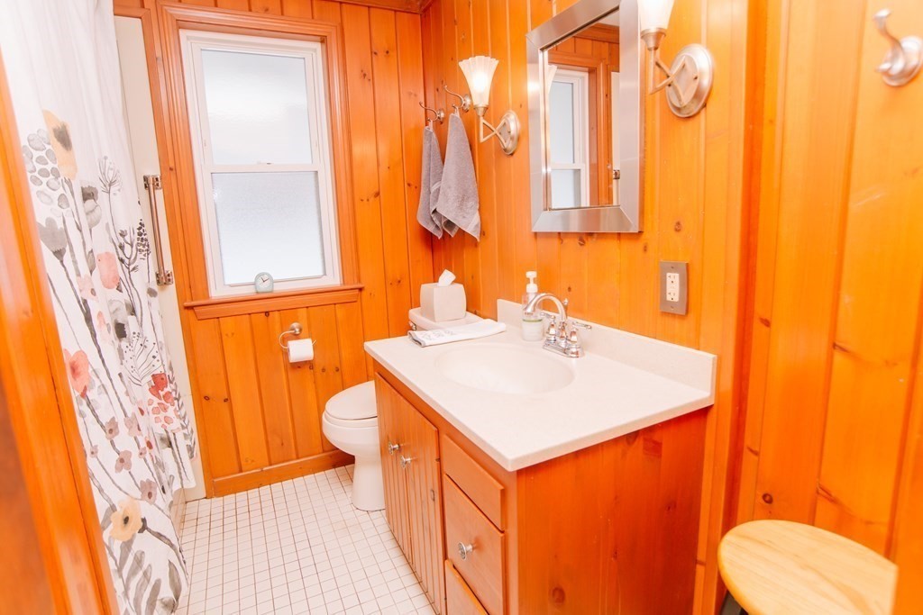 67 Campechi Street Springfield, MA 01104 - Photo 24 of 41 a bathroom with a sink a toilet and a mirror