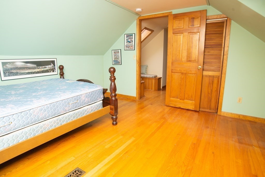 67 Campechi Street Springfield, MA 01104 - Photo 29 of 41 a bedroom with a bed and teddy bear on bed