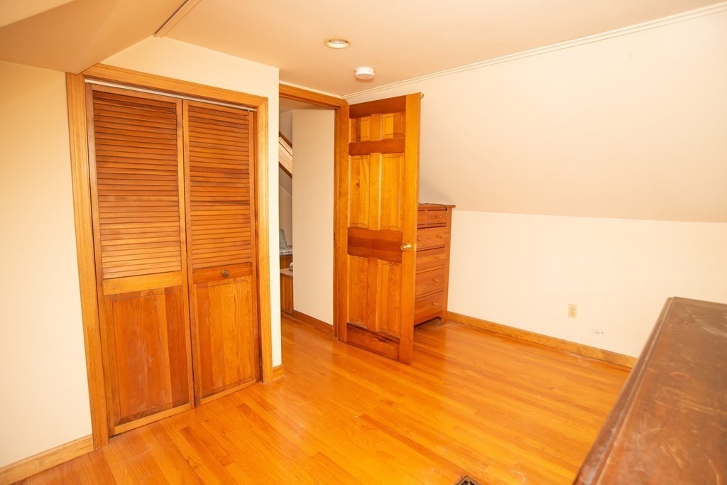 67 Campechi Street Springfield, MA 01104 - Photo 31 of 41 a view of empty room with wooden floor