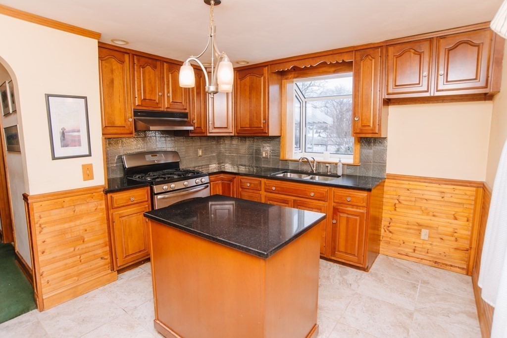 67 Campechi Street Springfield, MA 01104 - Photo 4 of 41 a kitchen with stainless steel appliances granite countertop a sink stove and refrigerator